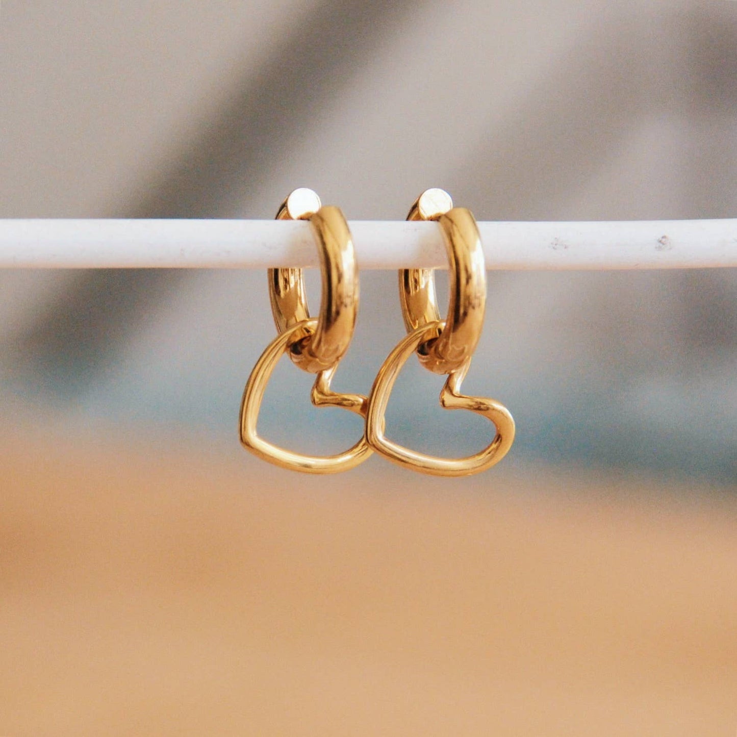 SHE CUTE | Hoop earrings with a golden heart